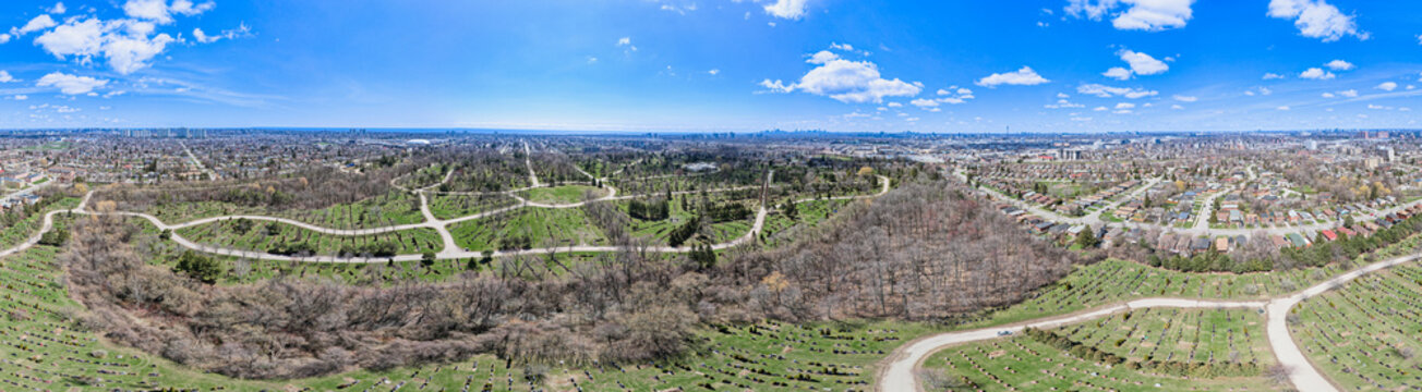 Artistic Creative View Of Great Toronto Area GTA City In Canada. Parks, Cemetery And Green Space With Low Rise Houses Skyline Cityscape And Car Roads In Ontario. Housing And Real Estate Concept.