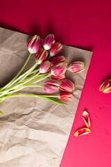 a bouquet of tulips lies on wrapping paper