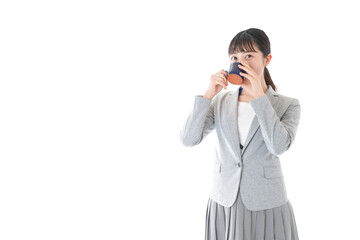 Young business woman drinking coffee