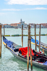 View of Venetian gondolas at sunrise in Venice, Italy