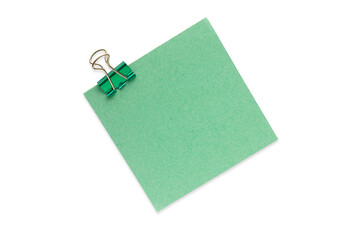 one green sticker with a paper clip on a white background