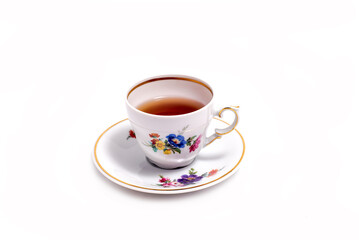 vintage tea cup and saucer isolated on white background