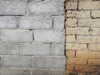 Two types of wall materials,stone and clay in close up,old and modern concept