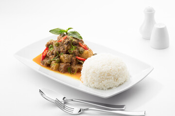 Close up view of stewed beef with vegetables on white back 