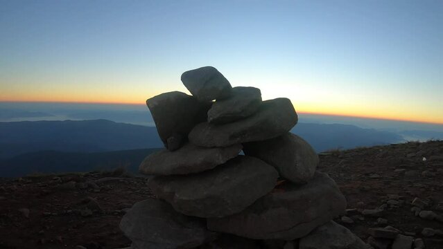 sunrise from rocks. dawn on the top of hoverla mountain. crawling over rocks towards the sun. highest mountains of ukraine. beautiful sunrise at the top. 