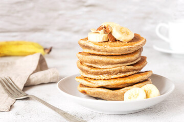 Wholegrain pancakes with banana. Delicious breakfast.