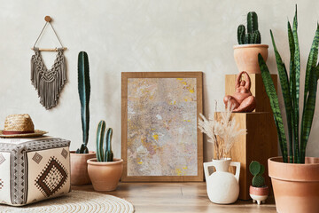 Creative composition of stylish living room interior with mock up poster frame, cacti and personal...