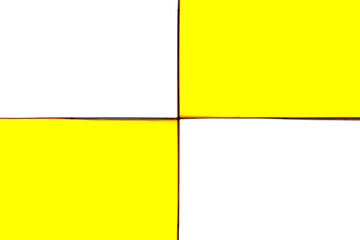 Fototapeta premium Two yellow and two white rectangles diagonally close-up. Geometric background of yellow and white colors.