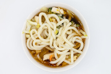 Japanese Style Chicken Udon Noodle Soup in Bowl with a White Background