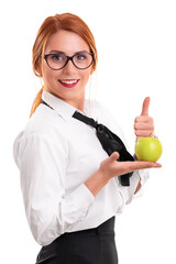 Young businesswoman holding apple and raising thumb up