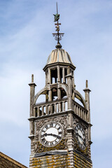 Fototapeta na wymiar Clocktower of Redesdale Hall in the Cotswolds, Gloucestershire, UK