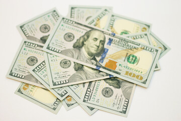 Stacks of paper 100 dollars USA on the white background