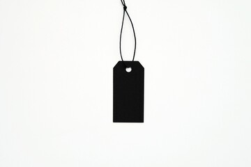 Black empty price tag hanging on black string, product hangtag mockup, Black Friday sale concept. - Powered by Adobe