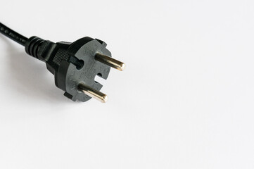 Black plug in white background,cost of electricity and expensive energy concept