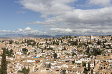 Fototapeta na wymiar Granada city, in Andalusia, Spain. This is the district of Albaycin as seen from the Alhambra Palace. Panoramic view.