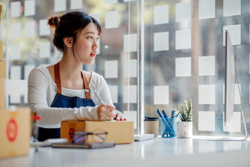 SME entrepreneur Small business entrepreneurs Online selling ideas,Happy Young Asian business owner...