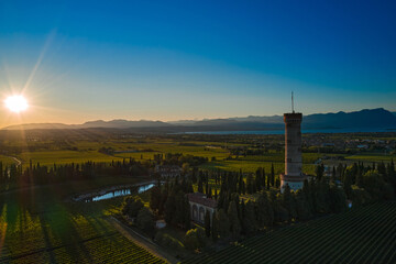 Tower of San Martino della Battaglia, Italy. Sunset. Vineyards of Italy on Lake Garda Italy.  Low sun. Celebration of the Italian Risorgimento. Aerial view of Lake Garda