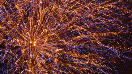 Colorful salute in the sky of St. Petersburg against the background of the night city