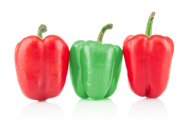 Red and green peppers close up isolated on white background