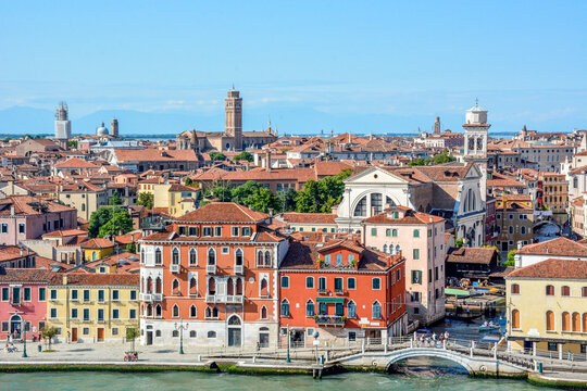 View from cruise ship departing Venice along the Giudecca Canal passing colourful waterside building in the Canal Rio de la Salute, from Fondamenta Zattere Al Saloni, Venice, Italy