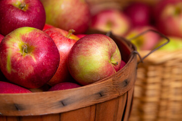 Red apples in rustic basket