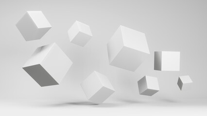 White cubes of different sizes suspended in weightlessness. White background.