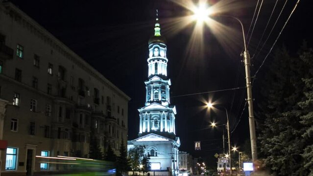 The bell tower of the Assumption Cathedral Uspenskiy Sobor day to night timelapse hyperlapse in Kharkiv, Ukraine