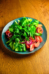Chopped vegetables and herbs on a plate