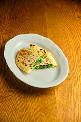 Flatbread stuffed with cheese and herbs. National Georgian dish