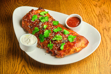 Grilled and smoked ribs with barbeque