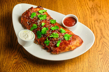 Grilled and smoked ribs with barbeque