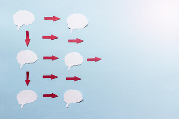 Simple infographics with brain cut outs and red arrows on blue background