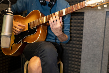 Fototapeta na wymiar recording song in recording studio with guitar