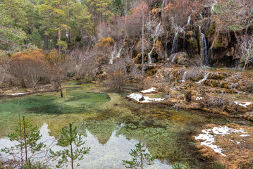 Fototapeta na wymiar Lagoon with waterfall in the mountains