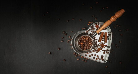 freshly roasted coffee beans. A bundle of coffee beans on a dark background, copy space.The aroma of coffee. Grains.