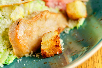 Caesar salad with large fried eggs