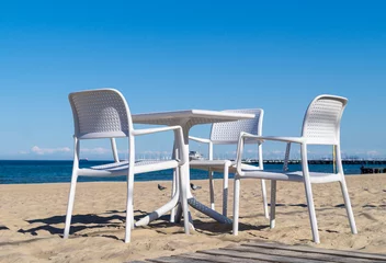 Papier Peint photo La Baltique, Sopot, Pologne  White chairs and table on the sandy beach