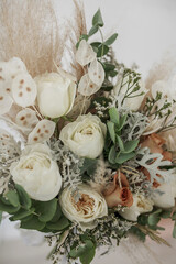 Boho wedding bouquet details with pampas grass, cappuccino rose, peony rose, eucalyptus, limonium