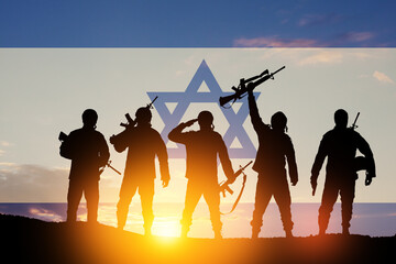 Silhouettes of soldiers against the sunrise in the desert and Israel flag. Concept - armed forces...