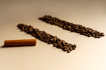 The concept of dependence on coffee. Two tracks of coffee and a straw of cinnamon. Like a drug