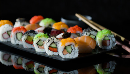 Sushi -  Plate with a Large Selection of Sushi and Rolls.