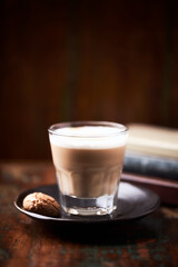 Coffee with milk on dark wooden background. Soft focus. Copy space.