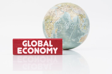 Near the globe is a red plaque with the inscription - global economy