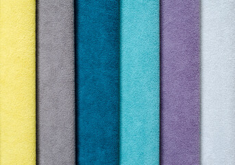 set of multi-colored dense fabrics of uniform texture.  choice of materials in different colors.