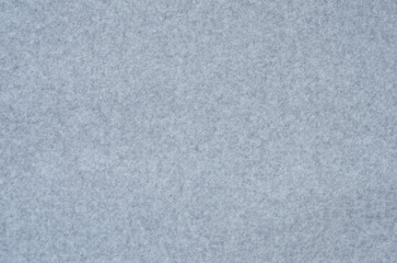 background. non-uniform surface of  fabric of light gray color. Fine pile material.