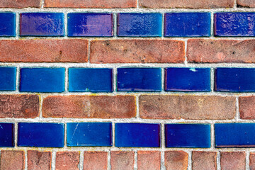 Red brick and glazed tile wall grunge texture background