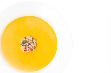 orange soup on a plate