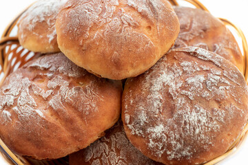 Homemade, fresh round-shaped buns with a crispy brown crust. Close-up. Background.