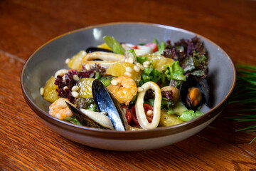 Mix of salad with seafood, shrimps and squid rings. Healthy food