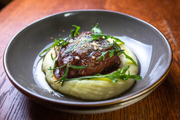 mashed potatoes with meat cutlet and herbs